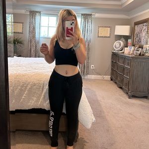 Black Pink sweatpants/joggers with Pink logo on the side size XS.